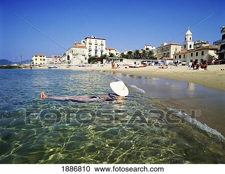 Woman Floating In The Water On Beach View Large Photo Image Stock Image - Woman Floating In The Water On Beach. Fotosearch