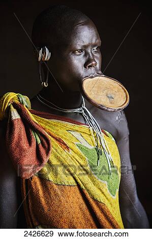 Stock Photo - Woman from the Suri (Surma) tribe with traditional clay lip plate, Omo region, Southwest Ethiopia; Kibish, Ethiopia. Fotosearch