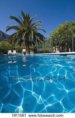 Woman Getting Out Of Outdoor Pool, Rear View, Soller, Majorca, Balearic Islands, Spain View Large Photo Image Stock Image - Woman Getting Out Of Outdoor Pool, Rear View, Soller, Majorca, Balearic Islands, Spain. Fotosearch