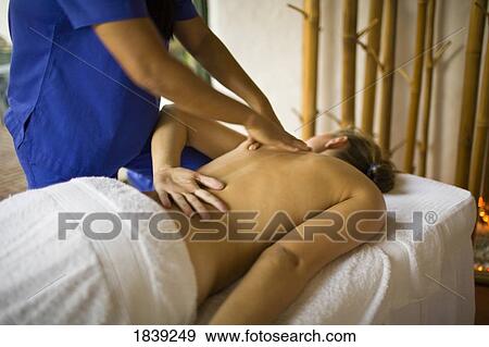 Woman Having Massage In Atlantis Beach Resort; Puerto Gallera, Mindoro Island, Philippines View Large Photo Image Stock Photo - Woman Having Massage In Atlantis Beach Resort; Puerto Gallera, Mindoro Island, Philippines. Fotosearch