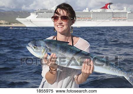 Stock Photography - Woman Holding Large Fish, Cabo San Lucas, Mexico. Fotosearch