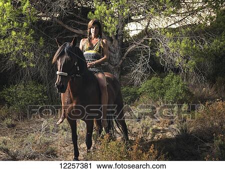 Woman horseback riding; Tarifa, Cadiz, Andalusia, Spain View Large Photo Image Stock Image - Woman horseback riding; Tarifa, Cadiz, Andalusia, Spain. Fotosearch