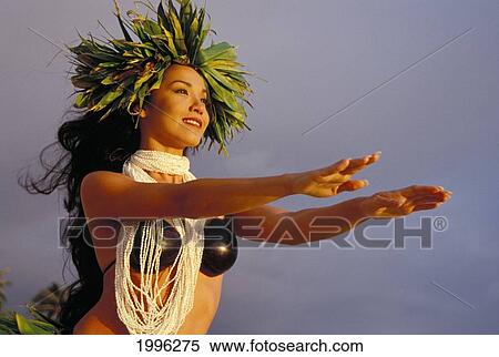 Stock Photography - Woman Hula With Shell Lei, Coconut Top, Ti Leaf Haku Arms Outstretched To Sky. Fotosearch