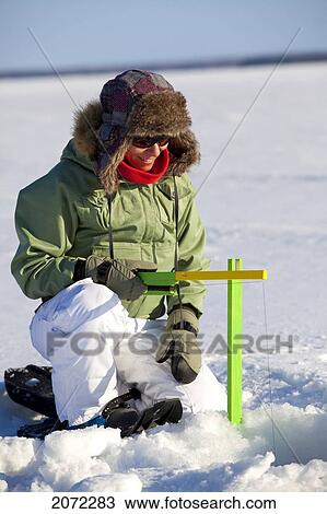 Woman Ice Fishing, Preissac Lake, Abitibi-Temiscamingue, Quebec View Large Photo Image Stock Image - Woman Ice Fishing, Preissac Lake, Abitibi-Temiscamingue, Quebec. Fotosearch