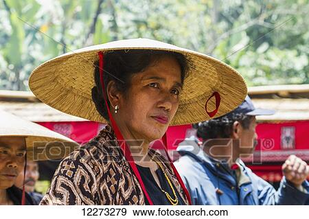 Woman in a formal funeral procession called MaÆpassa Tedong at a rante, the ceremonial site for a Torajan funeral, in Sereale, Toraja Land, South Sulawesi, Indonesia View Large Photo Image Stock Photo - Woman in a formal funeral procession called MaÆpassa Tedong at a rante, the ceremonial site for a Torajan funeral, in Sereale, Toraja Land, South Sulawesi, Indonesia. Fotosearch