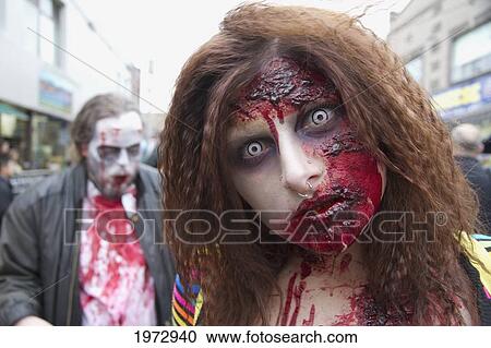 Stock Image - Woman In A Gruesome Costume At The Toronto Zombie Walk, Toronto, Ontario, Canada. Fotosearch