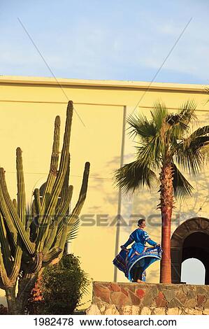 Woman In A Traditional Folkloric Dress Dancing In The Early Morning; Todos Santos Baja California Sur Mexico View Large Photo Image Stock Photo - Woman In A Traditional Folkloric Dress Dancing In The Early Morning; Todos Santos Baja California Sur Mexico. Fotosearch