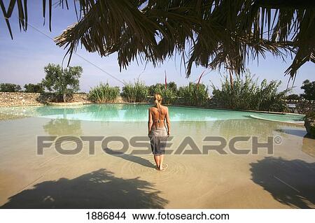 Woman In Bikini And Sarong Standing By Swimming Pool View Large Photo Image Picture - Woman In Bikini And Sarong Standing By Swimming Pool. Fotosearch