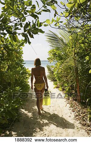 Woman In Bikini Walking To The Beach. View Large Photo Image Stock Image - Woman In Bikini Walking To The Beach.. Fotosearch