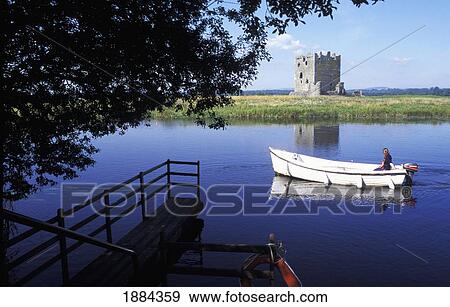 Woman In Boat Riding On Loch Past Castle View Large Photo Image Stock Photo - Woman In Boat Riding On Loch Past Castle. Fotosearch