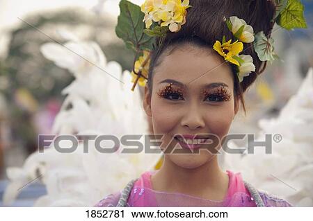Stock Image - Woman In Flower Festival, Chiang Mai, Thailand. Fotosearch