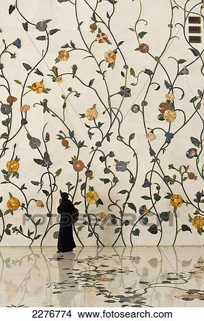 Picture - Woman In Front Of Decorated Wall In The Sheikh Zayed Grand Mosque, Abu Dhabi, United Arab Emirates. Fotosearch