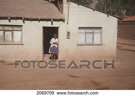 Woman In Front Of Their House In Atocha, Potosi Department, Bolivia View Large Photo Image Stock Photo - Woman In Front Of Their House In Atocha, Potosi Department, Bolivia. Fotosearch