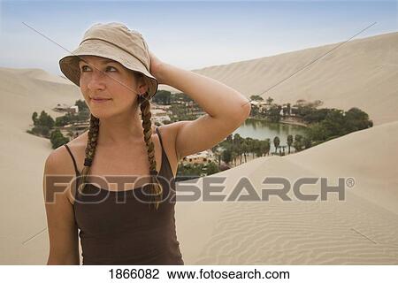 Woman In Hat In Sand Dunes, Huacachina Oasis; Huacachina Oasis, Peru View Large Photo Image Stock Image - Woman In Hat In Sand Dunes, Huacachina Oasis; Huacachina Oasis, Peru. Fotosearch