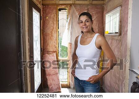 Woman in her 30s at entrance of her home that is being renovated; Bradford, Ontario, Canada View Large Photo Image Stock Image - Woman in her 30s at entrance of her home that is being renovated; Bradford, Ontario, Canada. Fotosearch