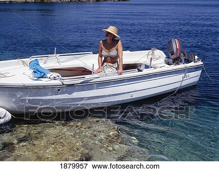 Stock Photo - Woman In Motorboat. Fotosearch