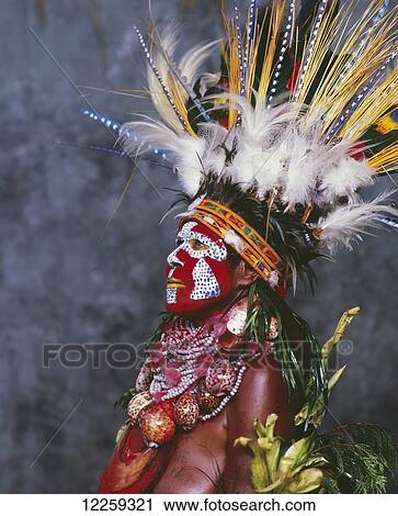 Stock Image - Woman in traditional bilas at Goroka Show; Goroka, Papua New Guinea. Fotosearch