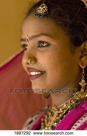 Stock Image - Woman In Traditional Rajasthani Sari And Jewellery, Side View. Fotosearch