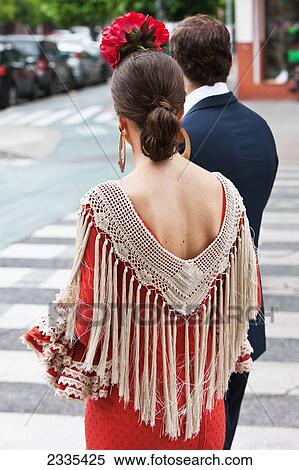 Stock Photography - Woman In Traditional Seville Dress During April Feria Festival; Seville, Andalucia, Spain, Europe. Fotosearch