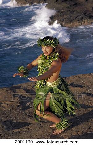 Stock Image - Woman Kahiko Hula By Sea Cliffs, Topless With Leis Side Angle D1388. Fotosearch