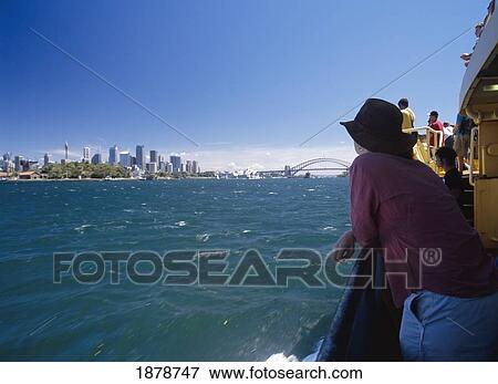 Woman Leaning On Railing On A Ferry Passing Sydney City Centre View Large Photo Image Stock Photo - Woman Leaning On Railing On A Ferry Passing Sydney City Centre. Fotosearch