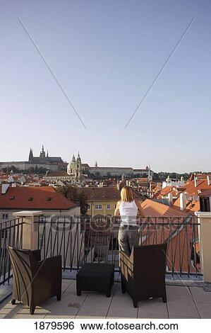 Woman Leaning On Roof Terrace Looking Over Prague Cityscape View Large Photo Image Stock Photograph - Woman Leaning On Roof Terrace Looking Over Prague Cityscape. Fotosearch