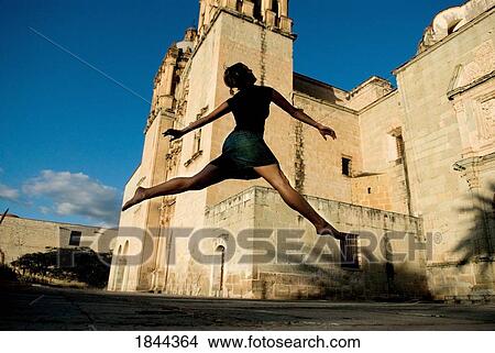 Woman Leaping In Old Town; Mexico View Large Photo Image Picture - Woman Leaping In Old Town; Mexico. Fotosearch