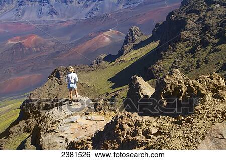 Woman looking at the cinder cones from the Kalahaku Overlook, Haleakala Natonal Park; Maui, Hawaii, United States of America View Large Photo Image Stock Photograph - Woman looking at the cinder cones from the Kalahaku Overlook, Haleakala Natonal Park; Maui, Hawaii, United States of America. Fotosearch