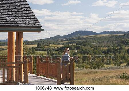 Woman Looking Out Into The Hills View Large Photo Image Stock Photo - Woman Looking Out Into The Hills. Fotosearch