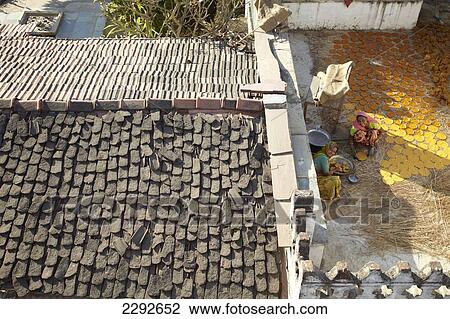 Woman making chapatis on the roof of Castle Bijapur2 Rajasthan India View Large Photo Image Stock Image - Woman making chapatis on the roof of Castle Bijapur2 Rajasthan India. Fotosearch
