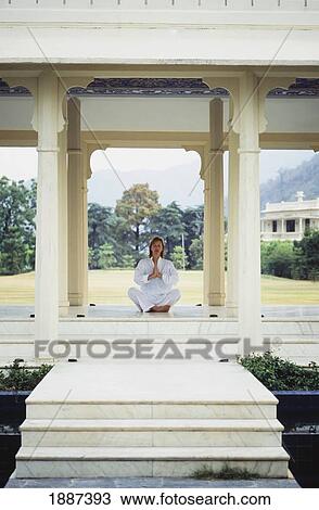 Woman Meditating At Ananda Spa In The Himalayas. View Large Photo Image Stock Image - Woman Meditating At Ananda Spa In The Himalayas.. Fotosearch