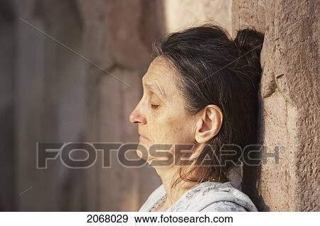 Stock Photo - Woman Meditating, Mahabodi Temple, Bodhgaya, Bihar, India. Fotosearch