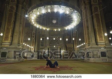 Woman Meditating Under Chandelier In Temple View Large Photo Image Picture - Woman Meditating Under Chandelier In Temple. Fotosearch