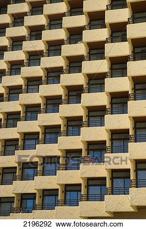 Stock Image - Woman On Balcony Of Hotel, Torremolinos, Andalucia, Spain.. Fotosearch