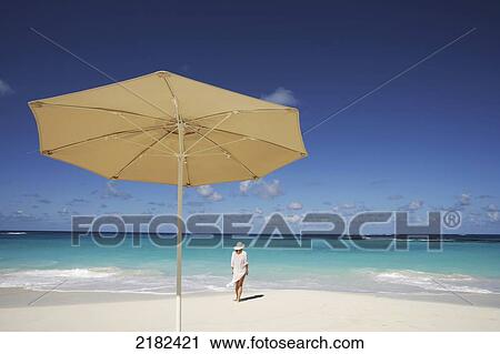 Stock Image - Woman On Beach, Anguilla. Fotosearch