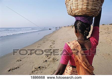 Stock Photo - Woman On Beach, Chennai. Fotosearch