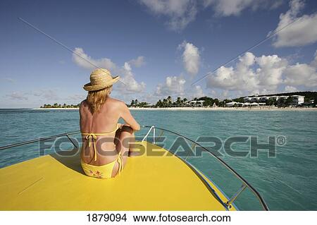 Picture - Woman On Boat, Ku Hotel, Shoal Bay, Anguilla. Fotosearch