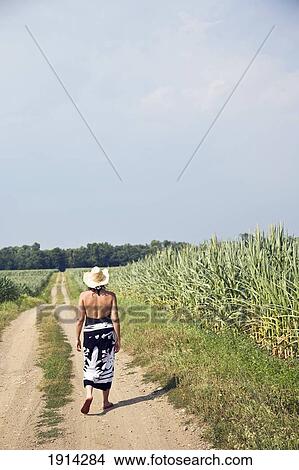 Woman On Path Inbetween Corn Fields View Large Photo Image Picture - Woman On Path Inbetween Corn Fields. Fotosearch