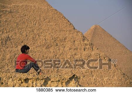 Woman On Rocky Outcrop Looking Over Pyramids View Large Photo Image Stock Photography - Woman On Rocky Outcrop Looking Over Pyramids. Fotosearch