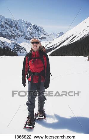 Woman On Snowshoes In The Snow View Large Photo Image Stock Image - Woman On Snowshoes In The Snow. Fotosearch