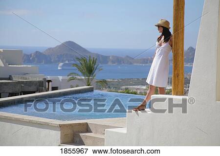 Stock Photo - Woman On Terrace, Cabo San Lucas, Mexico. Fotosearch