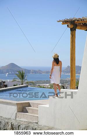 Woman On Terrace Of Resort, Cabo San Lucas, Mexico View Large Photo Image Stock Image - Woman On Terrace Of Resort, Cabo San Lucas, Mexico. Fotosearch