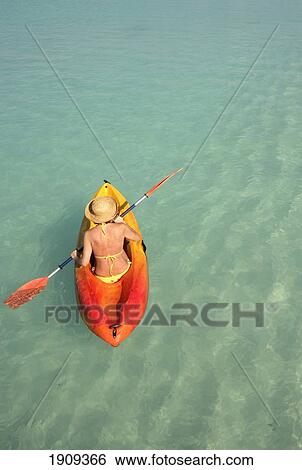 Woman Paddling Canoe On Ocean, Elevated View, Dhuni Kolhu Island, Maldives View Large Photo Image Stock Photograph - Woman Paddling Canoe On Ocean, Elevated View, Dhuni Kolhu Island, Maldives. Fotosearch