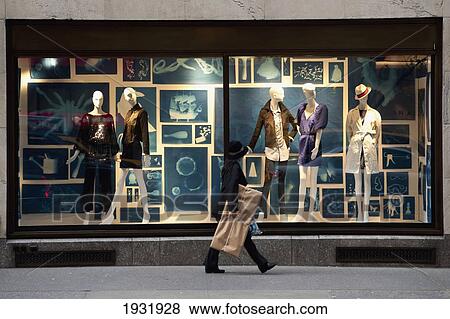 Woman Passing By A Designer Shop In 5Th Avenue, Midtown Manhattan, New York, Usa View Large Photo Image Stock Photo - Woman Passing By A Designer Shop In 5Th Avenue, Midtown Manhattan, New York, Usa. Fotosearch