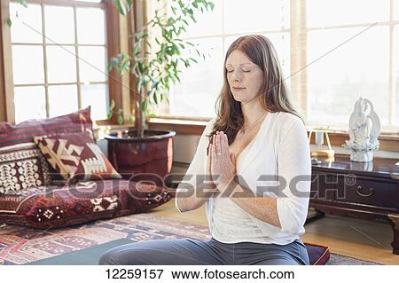 Woman practices yoga at indoor studio, Homer, Alaska View Large Photo Image Stock Photo - Woman practices yoga at indoor studio, Homer, Alaska. Fotosearch