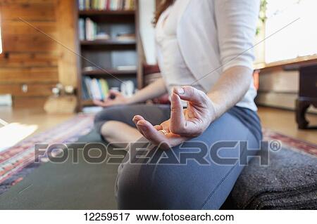 Stock Photo - Woman practices yoga at indoor studio, Homer, Alaska. Fotosearch