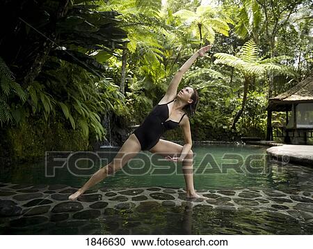 Woman Practicing Yoga In Holiday Resort; Bali, Indonesia View Large Photo Image Stock Image - Woman Practicing Yoga In Holiday Resort; Bali, Indonesia. Fotosearch