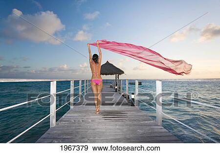 Woman Practicing Yoga On Tropical Beach, Lotus Position. View Large Photo Image Stock Photo - Woman Practicing Yoga On Tropical Beach, Lotus Position.. Fotosearch