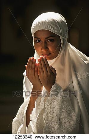Woman praying in a mosque; Bandar Seri Begawan, Brunei View Large Photo Image Stock Image - Woman praying in a mosque; Bandar Seri Begawan, Brunei. Fotosearch
