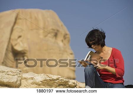 Woman Reading Guidebook In Front Of Sphinx View Large Photo Image Stock Photo - Woman Reading Guidebook In Front Of Sphinx. Fotosearch
